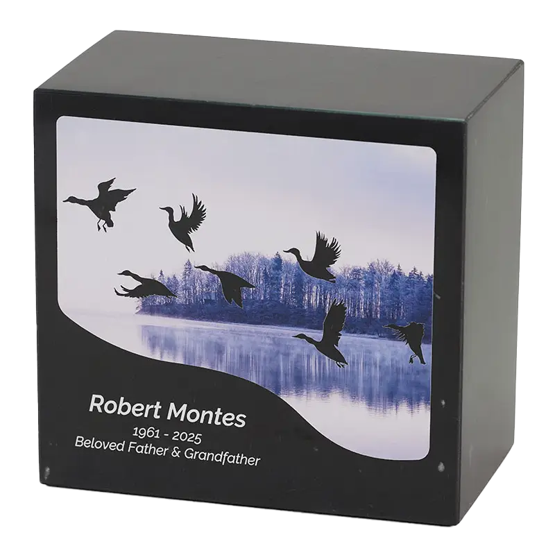 Black Marble urn with ducks flying across a lake