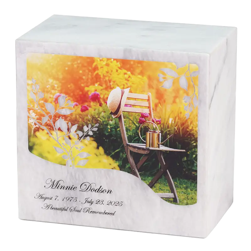 White Marble urn with a design featuring an empty chair in a garden